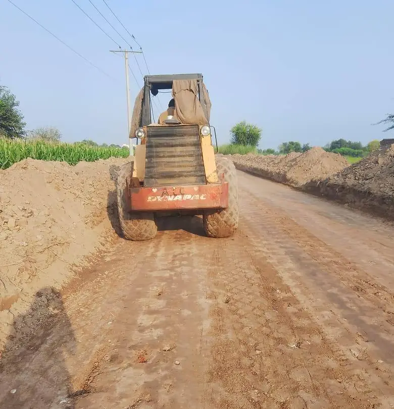Road construction with machinery